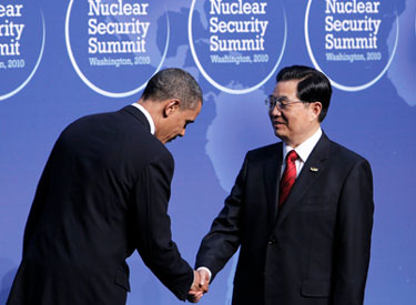 Chinese President Hu Jintao is greeted by President Barack Obama at Nuclear Security Summit